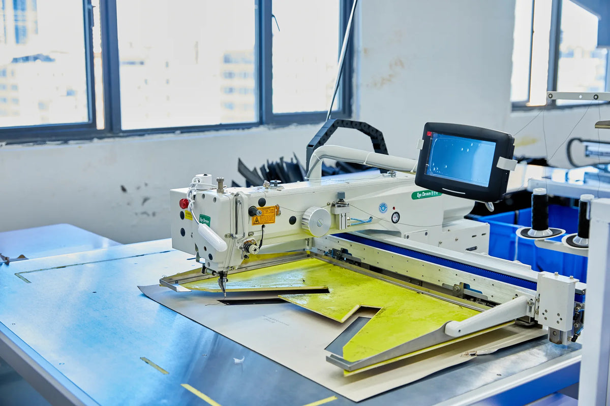 Programmable sewing station